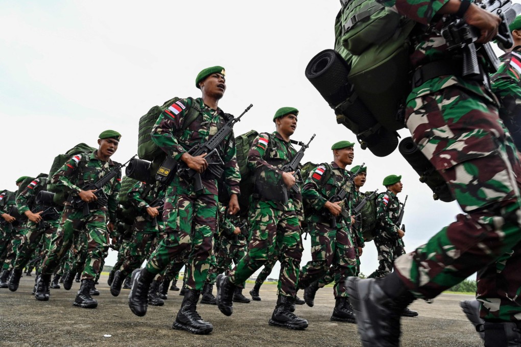 Indonesian soldiers take part in a ceremony in Aceh before travelling to Papua for deployment in 2023. Photo: AFP