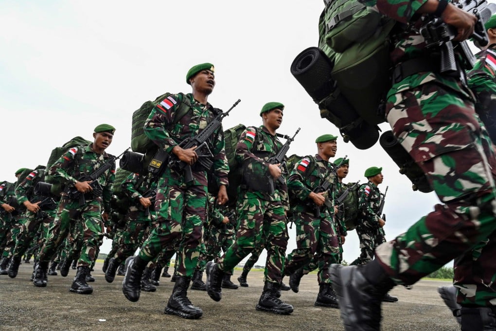 Indonesian soldiers take part in a ceremony in Aceh before travelling to Papua for deployment in 2023. Photo: AFP