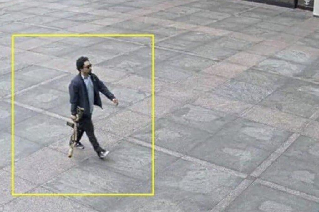 Shane Tamura is seen in a surveillance video outside the NFL office building on Monday. Photo: AP