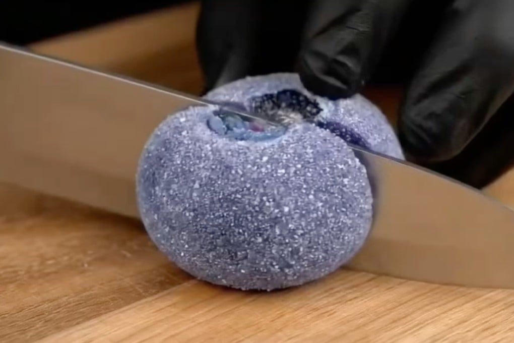 A still from an AI ASMR video showing someone slicing sugared blueberries. The video, which also shows other fruit being cut up, was posted in July by RedNote user Yu Mu and has received more than 7,000 likes. Photo: Rednote/ Healing Lab
