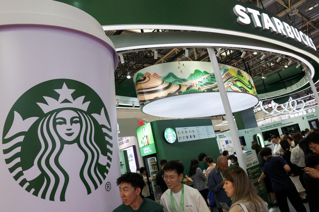 People visit the Starbucks booth during the China International Supply Chain Expo in Beijing this month. Photo: Reuters