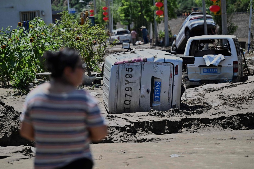 On Wednesday in Huairou district, on the outskirts of Beijing, the devastation wrought by heavy rain is evident. The toll has been rising over the week as floods and a landslide have claimed  44 lives, with more missing. Photo: AFP
