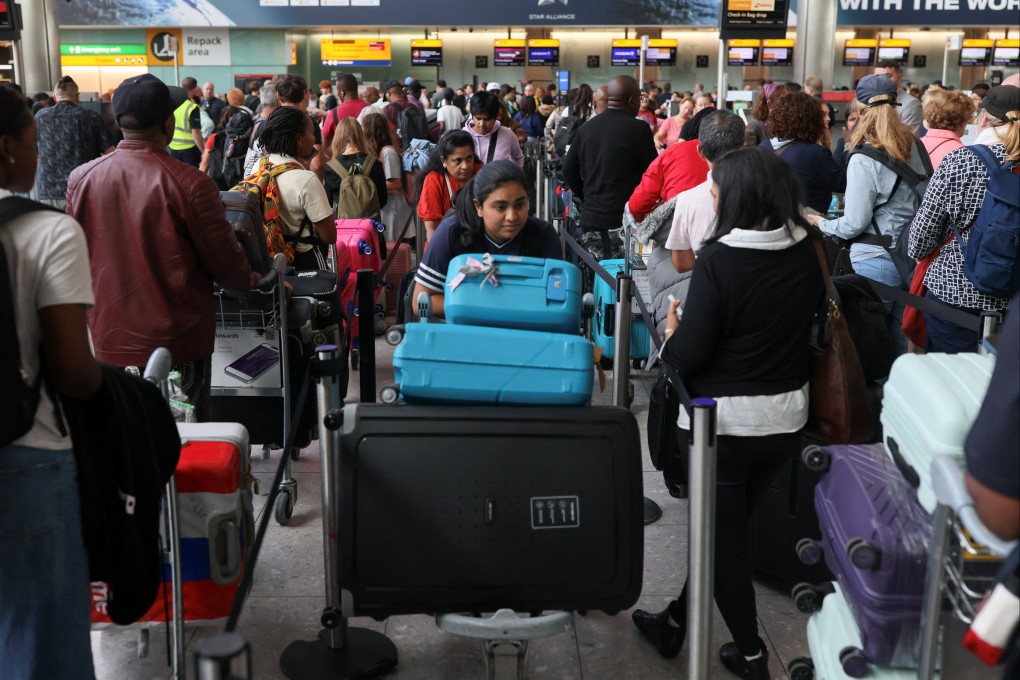 Passengers wait at Heathrow Airport after radar failure led to the suspension of outbound flights across the UK, in Hounslow, London on Wednesday. Photo: Reuters