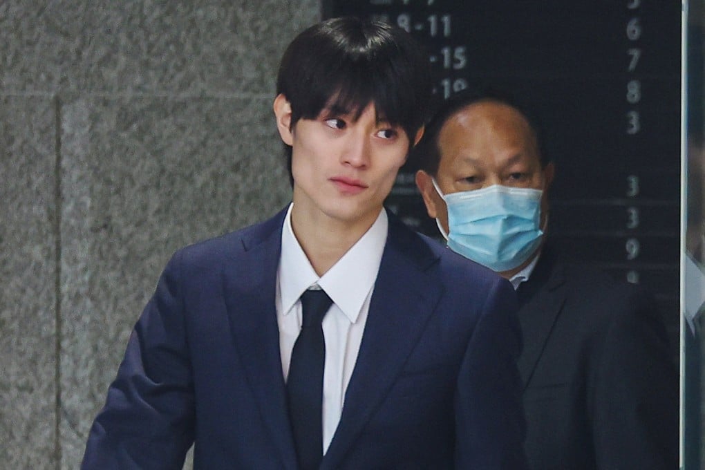 Kenshin Kamimura (left) leaves West Kowloon Court on Thursday. Photo: Edmond So