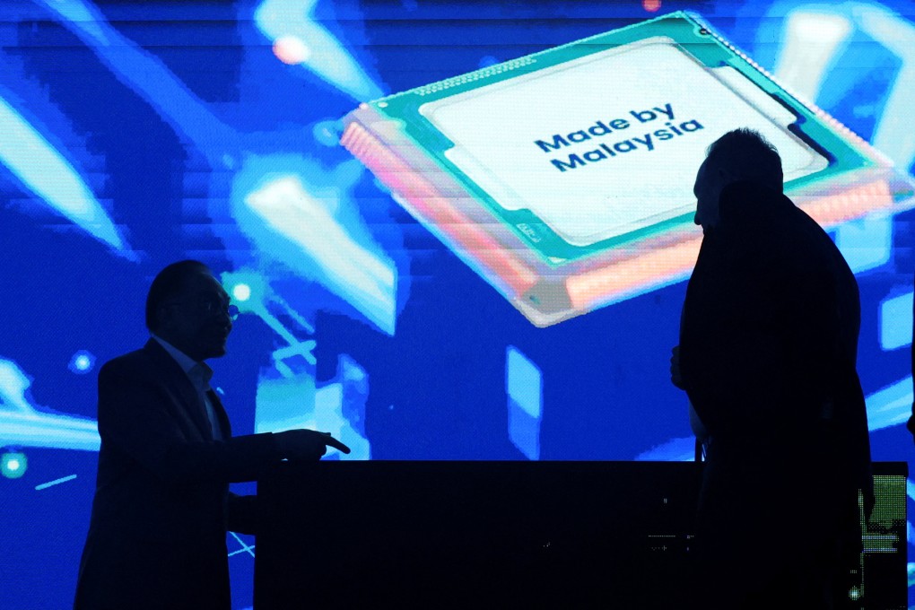 A projection of a ‘Made by Malaysia’ chip against the silhouettes of Malaysia’s Prime Minister Anwar Ibrahim and Rene Haas, CEO of chip tech provider Arm Holdings, at an event in Kuala Lumpur in March. Photo: Reuters