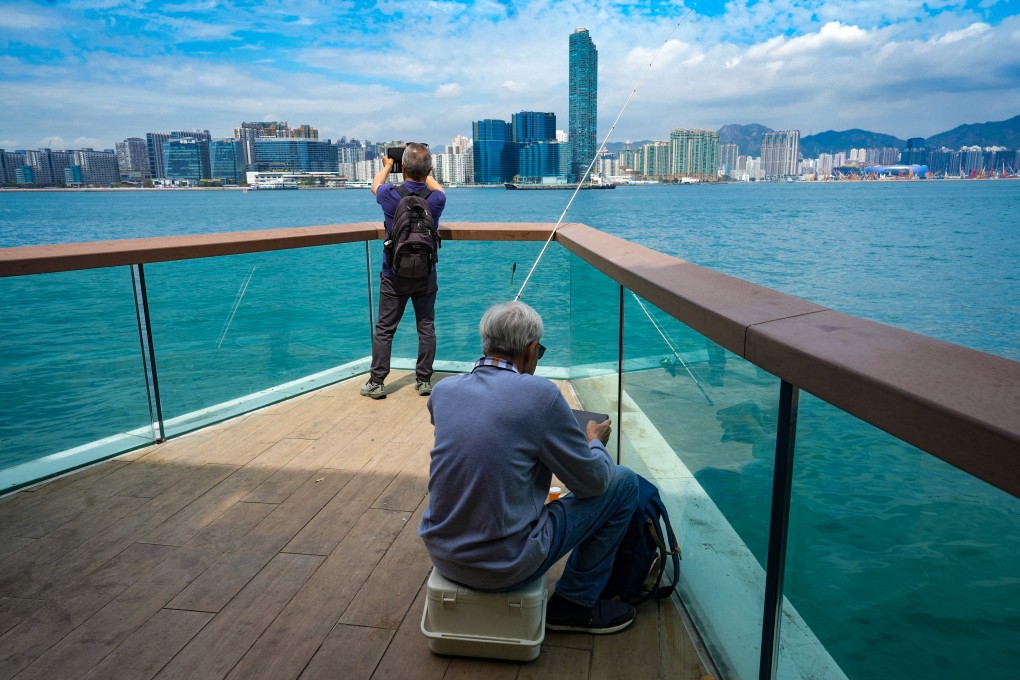 Visitors take pictures at East Coast Boardwalk in Hong Kong’s North Point. Photo: Sun Yeung