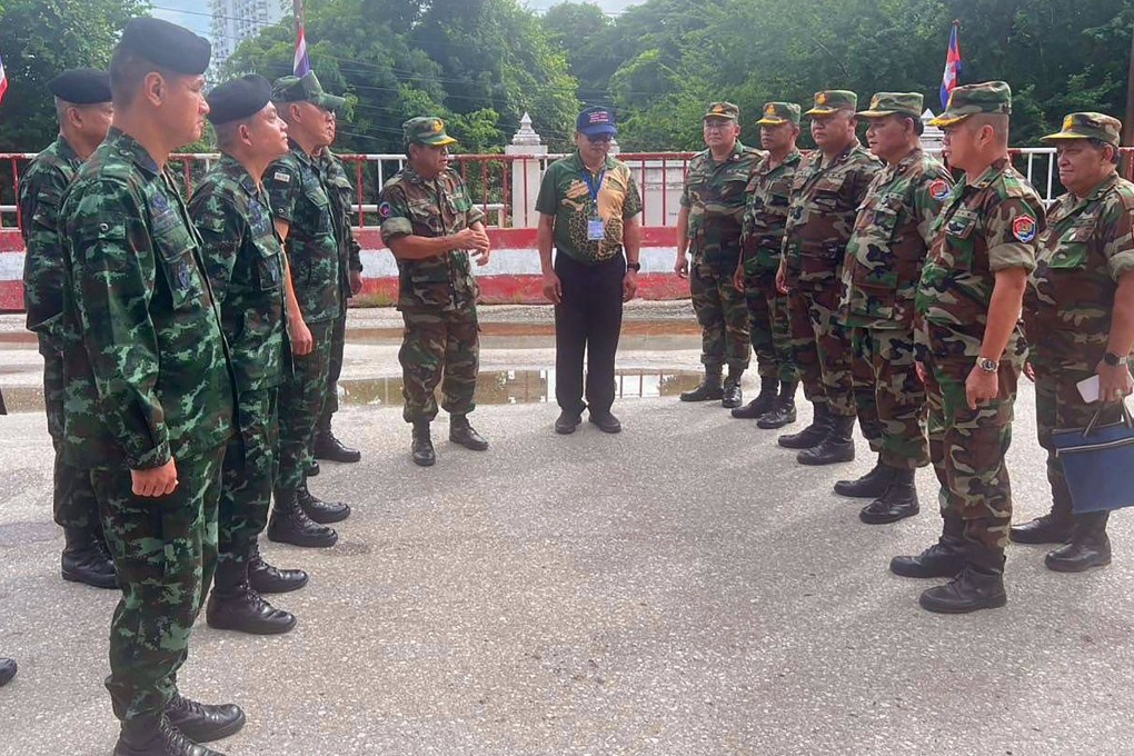 Commanders of the Royal Thai Army (left) and Royal Cambodian Army (right) meet in no man’s land at the Thai-Cambodia border near the Aranyaprathet-Poipet border crossing on Tuesday. Photo: Royal Thai Army/AFP