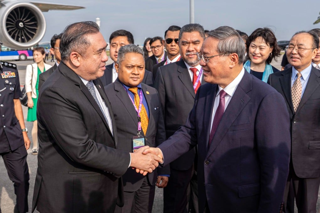 Anthony Loke greets Premier Li Qiang in Kuala Lumpur in May. Photo: Handout