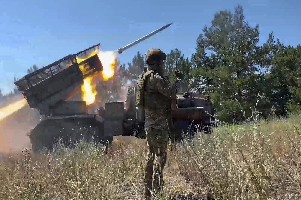 A Russian Army rocket launcher fires towards the Ukrainian position in an undisclosed location in Ukraine. Photo: Russian Defense Ministry Press Service/AP