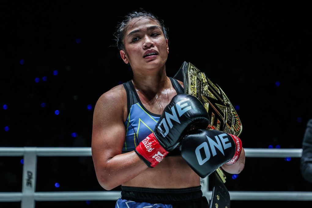 Jackie Buntan poses with the strawweight kickboxing championship belt after beating Anissa Meksen at ONE Fight Night 169. Photo: ONE Championship