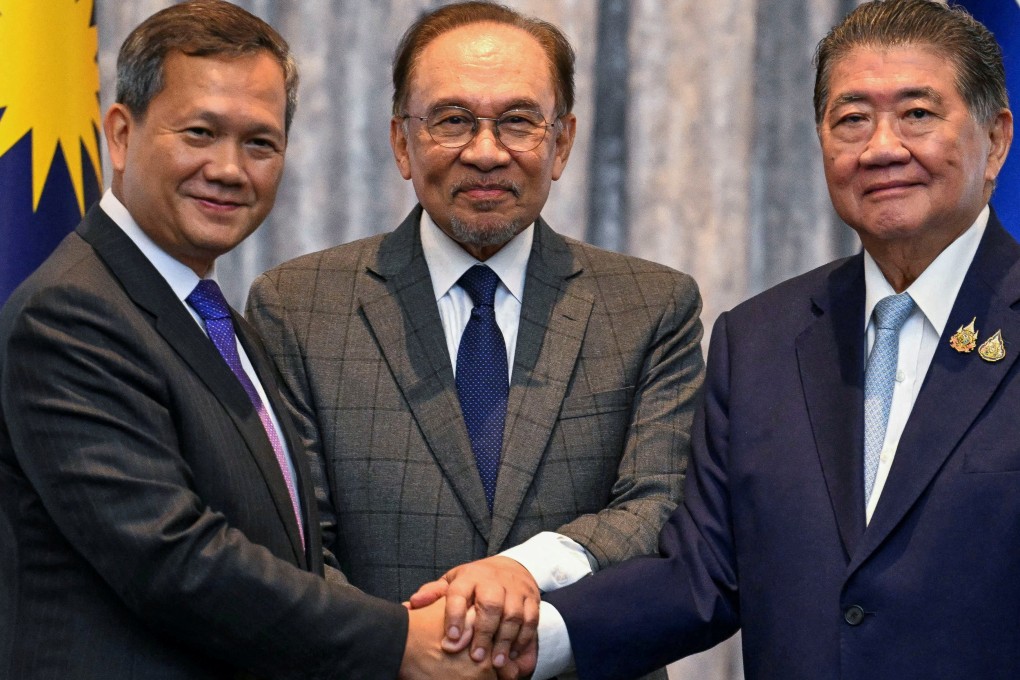 (From left) Cambodia’s Prime Minister Hun Manet, Malaysia’s Prime Minister Anwar Ibrahim and Thailand’s Acting Prime Minister Phumtham Wechayachai shake hands after mediation talks on the Thailand-Cambodia border conflict in Malaysia on Monday. Photo: Reuters