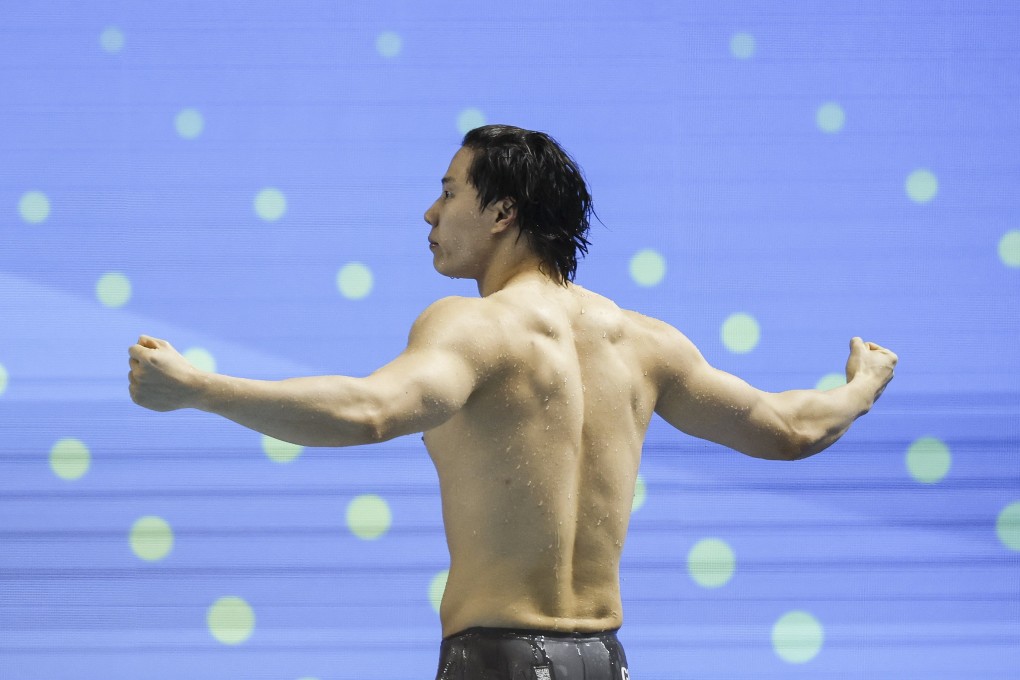 China’s Qin Haiyang celebrates winning the 200m breaststoke final at the World Aquatics Championships in Singapore on Friday. Photo: EPA