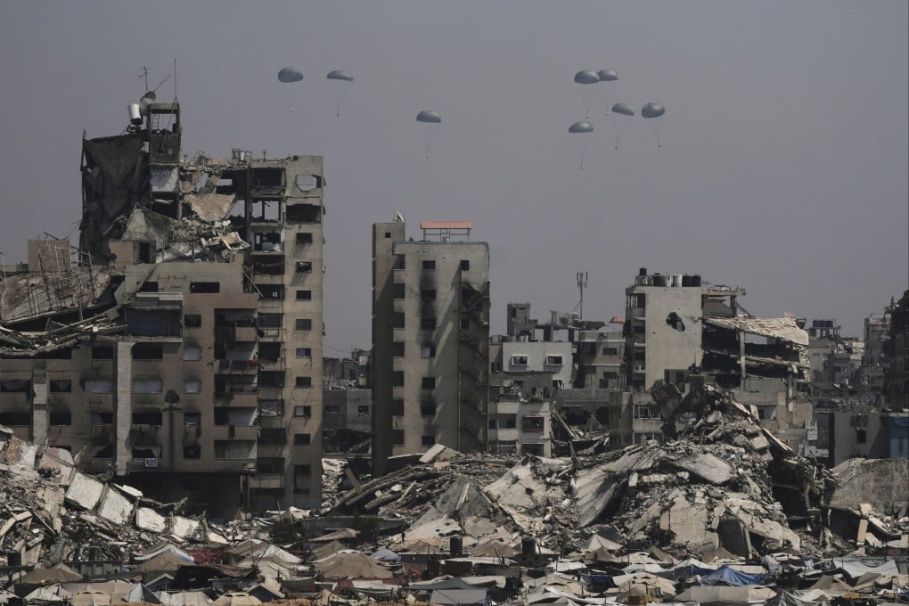 Humanitarian aid is airdropped to Palestinians over Gaza City on Monday. Photo: AP
