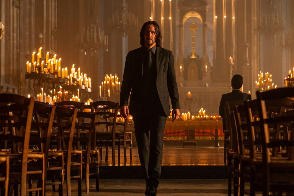 Keanu Reeves in a still from the film John Wick: Chapter 4. Amid declining box offices and streaming challenges, major deals signal that there is still ongoing interest in movie studios. Photo: Getty Images