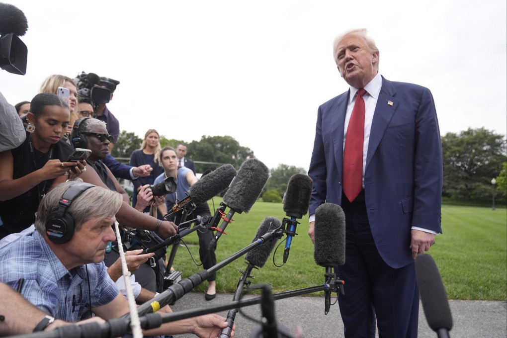 US President Donald Trump talks to reporters on the South Lawn of the White House Friday. Photo: AP
