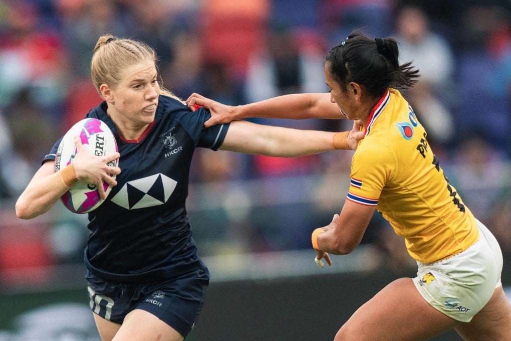 Rosie Wright (left) resists a Thailand challenge during this year’s Cathay/HSBC Hong Kong Sevens. Photo: Hong Kong China Rugby