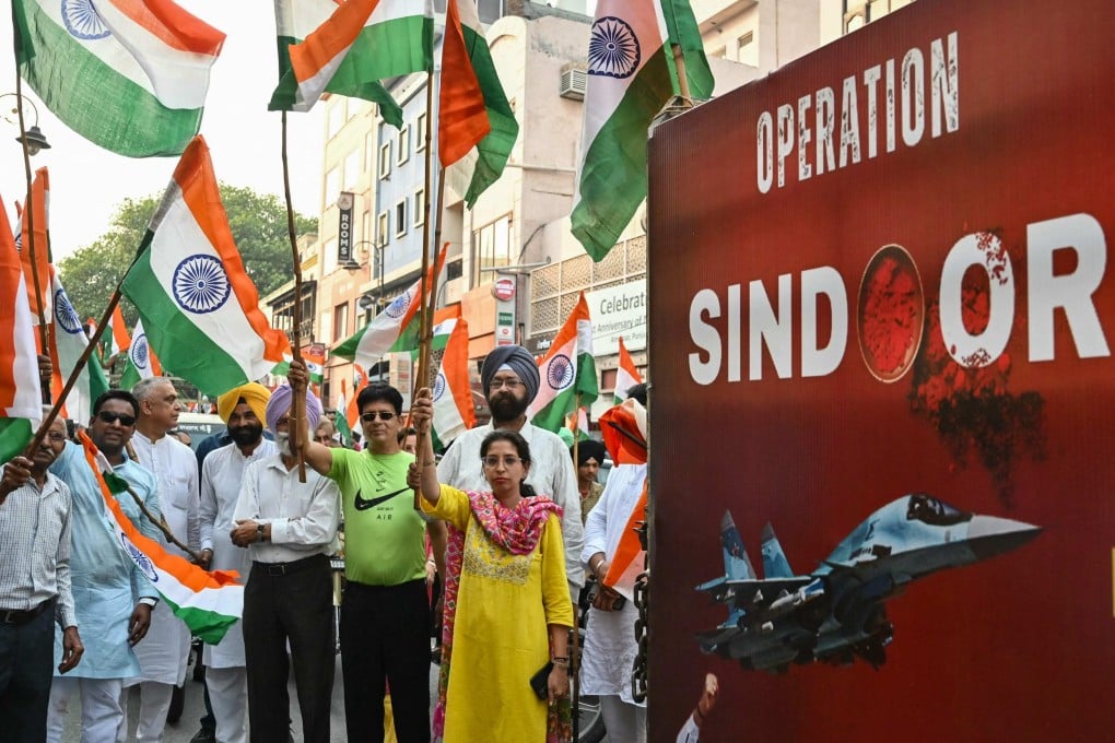 Bharatiya Janata Party supporters wave Indian national flags to celebrate the success of Operation Sindoor on May 17. Photo: AFP
