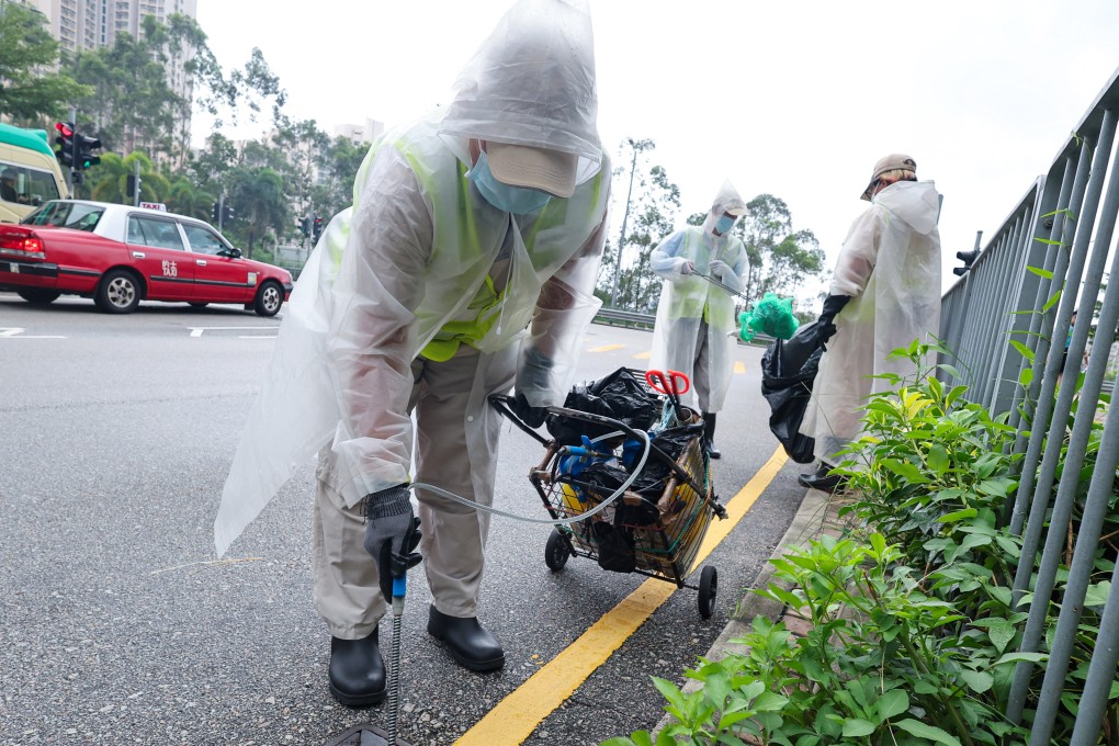 Hygiene authorities carry out mosquito control measures near On Tat Estate. Photo: Dickson Lee