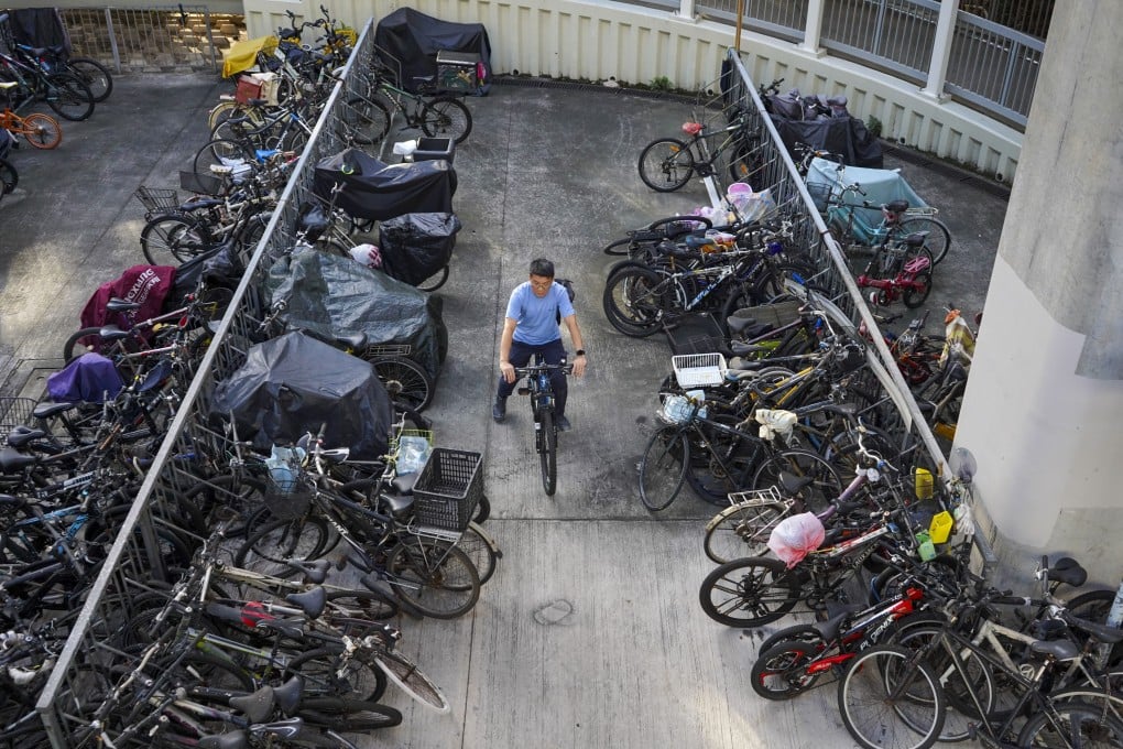 A cyclist looks to exit an area packed with bikes in Sha Tin. Photo: Timon Johnson