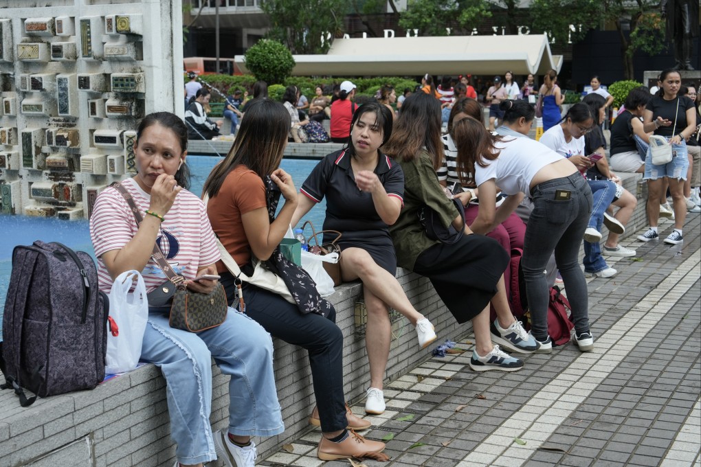 Foreign domestic helpers gather at Central on their day off. Photo: Sun Yeung