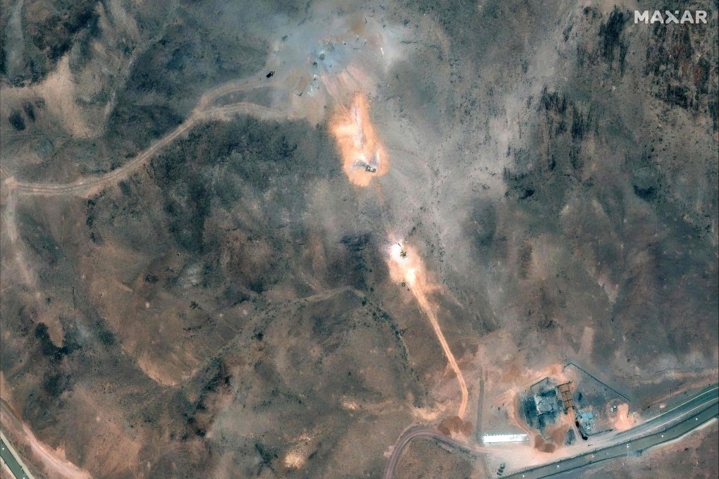 Activity near the perimeter building and southern holes caused by the June 22 US airstrike on the Fordow Fuel Enrichment Plant complex in Iran.: Photo: Satellite image ©2025 Maxar Technologies/AFP