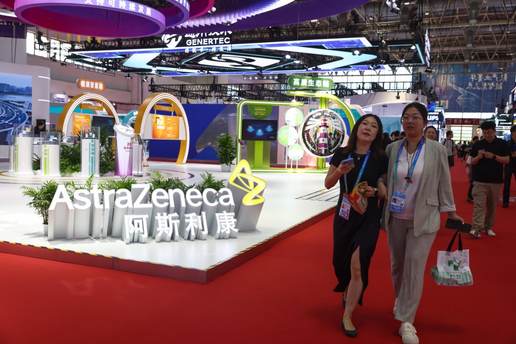 Visitors walk beside the booth of British-Swedish multinational pharmaceutical and biotechnology company AstraZeneca during the third China International Supply Chain Expo in Beijing on July 17. Photo: EPA