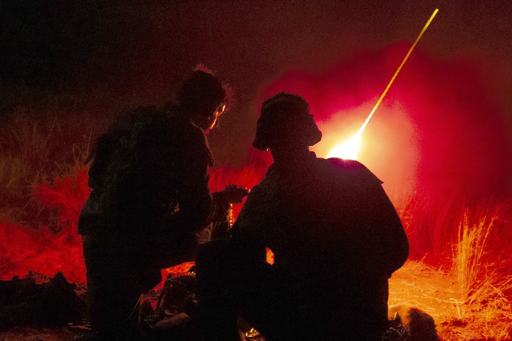 Australian Army soldiers fire a MAG 58 during an exercise at the Townsville Field Training Area. Photo: Australian Defence Force/AFP