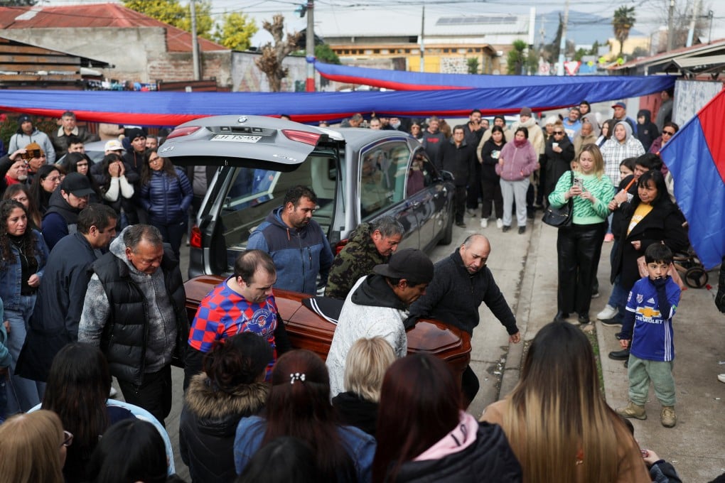 The body of a dead miner is brought back to his neighbourhood after Chilean state-run copper producer Codelco confirmed the death of several other miners. Photo: Reuters