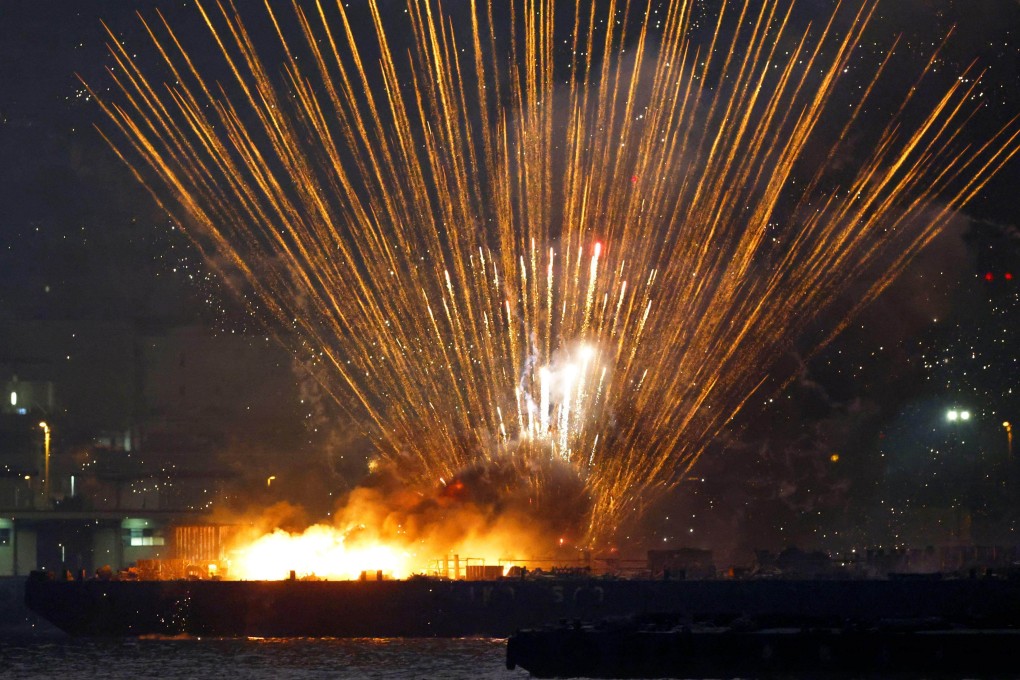 Fireworks explode above a barge that had caught fire as it launched them during a festival in Yokohama on Monday night. 
Photo: Kyodo