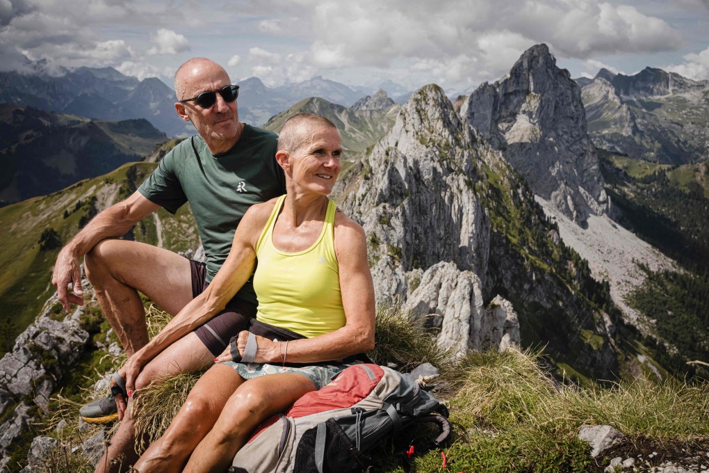 Cathy Rotzetter and Patrick, both 58, sit atop Wandflue peak in the Swiss canton of Fribourg. The couple found each other through “Mountain Tinder”. Photo: AFP
