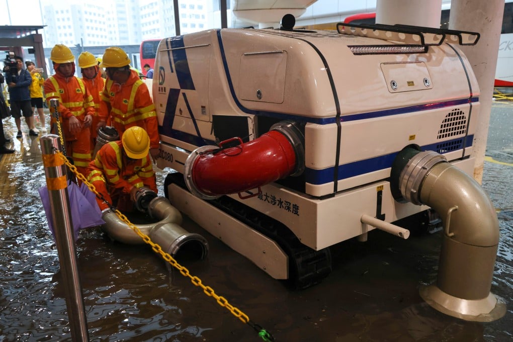 Officers of Hong Kong’s Fire Services Department respond to flooding at Queen Mary Hospital in Pok Fu Lam. Photo: Karma Lo