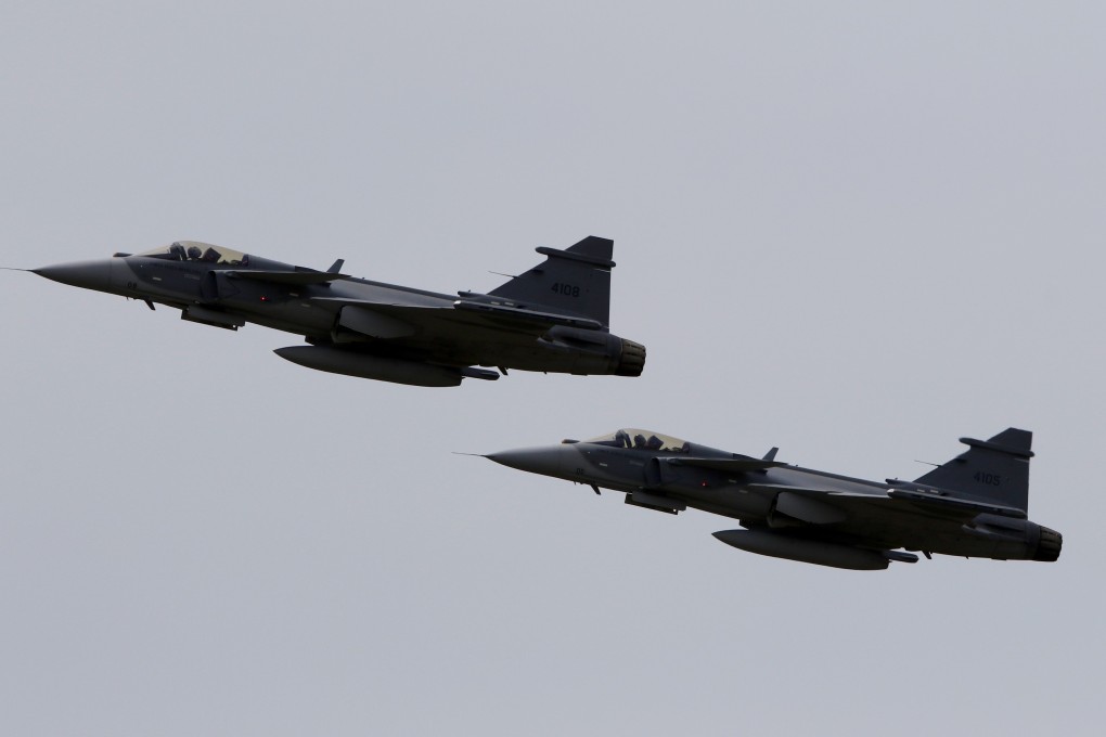 Swedish-built Gripen aircraft fly at an air show in Colombia last month. Photo: EPA