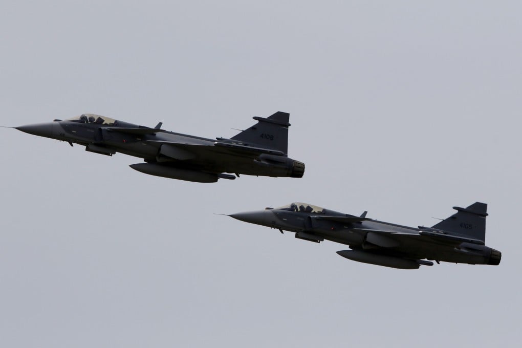 Swedish-built Gripen aircraft fly at an air show in Colombia last month. Photo: EPA