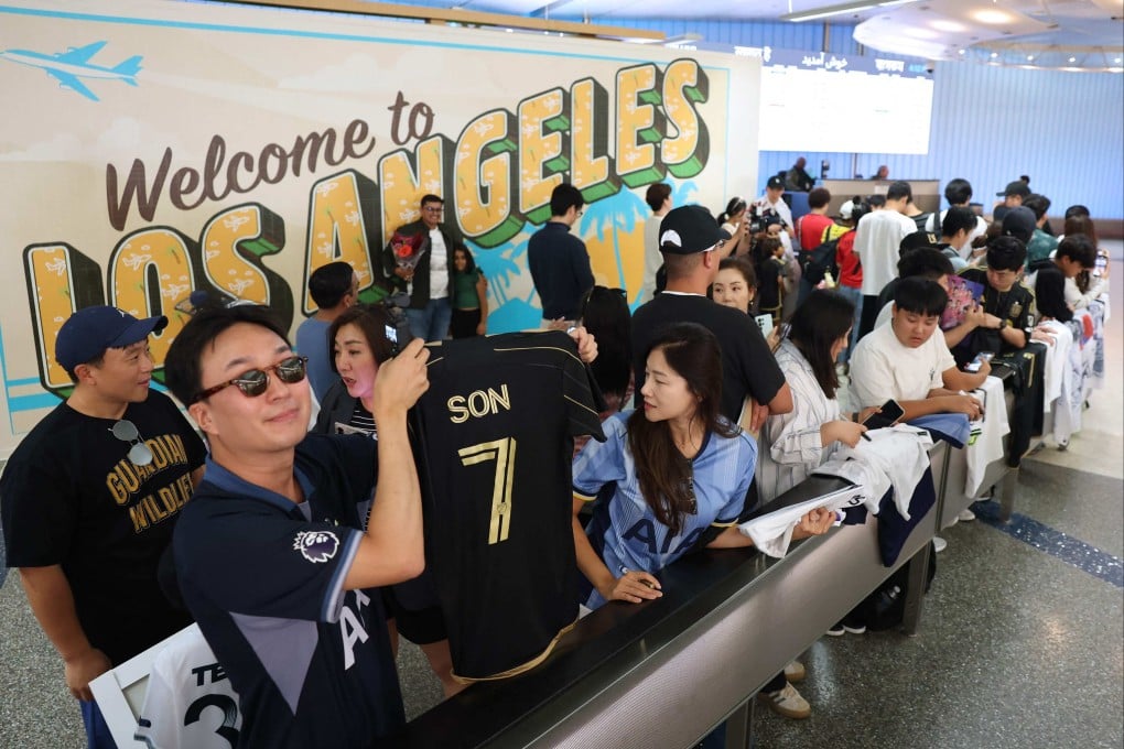 A crowd awaits South Korean footballer Son Heung-min at Los Angeles International Airport. Photo: AFP