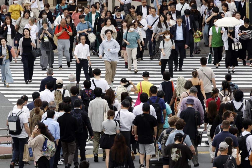 Pedestrians walk through a crossing at Shinjuku business and shopping district in Tokyo. According to government data, the country’s population decline accelerated due amid record low births. Photo: EPA-EFE