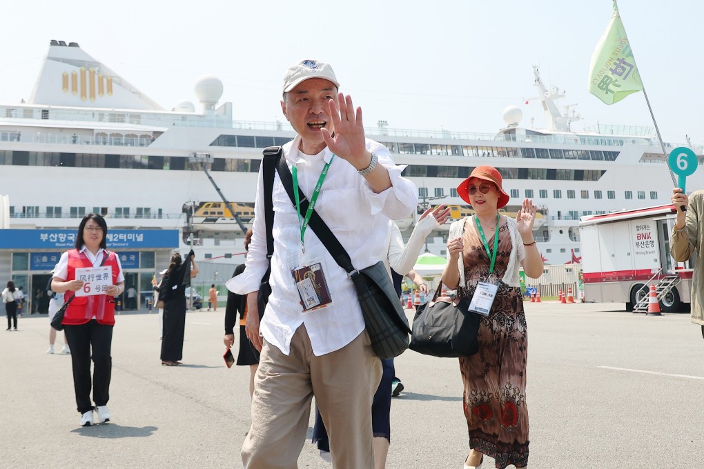 Chinese tourists wave upon entering South Korea’s largest port city of Busan last year. Photo: EPA-EFE