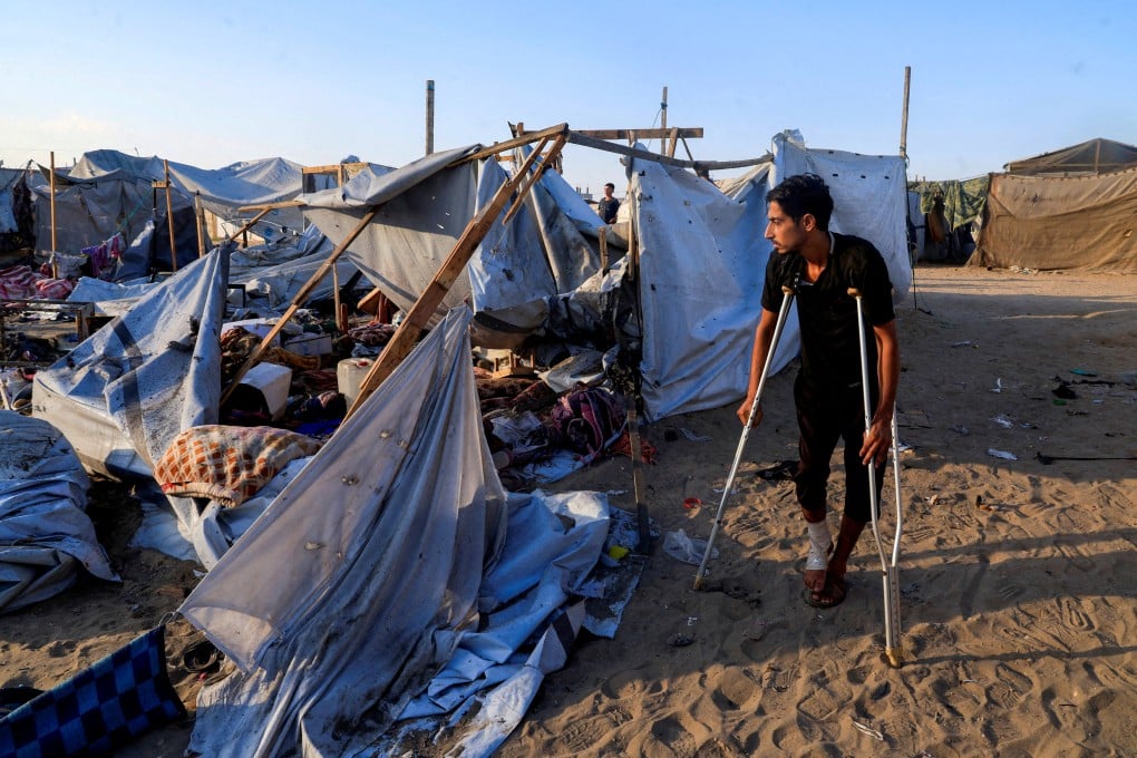 A Palestinian man inspects damage at the site of an overnight Israeli strike on a camp for displaced people in southern Gaza on Tuesday. China has joined calls against a possible complete Israeli takeover of Gaza. Photo: Reuters