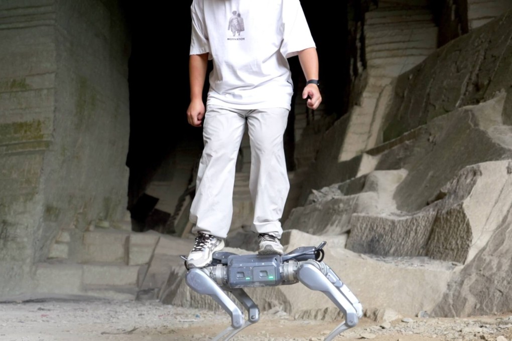 A man stands on Unitree Robotics’ new robot dog, the A2. Photo: Handout