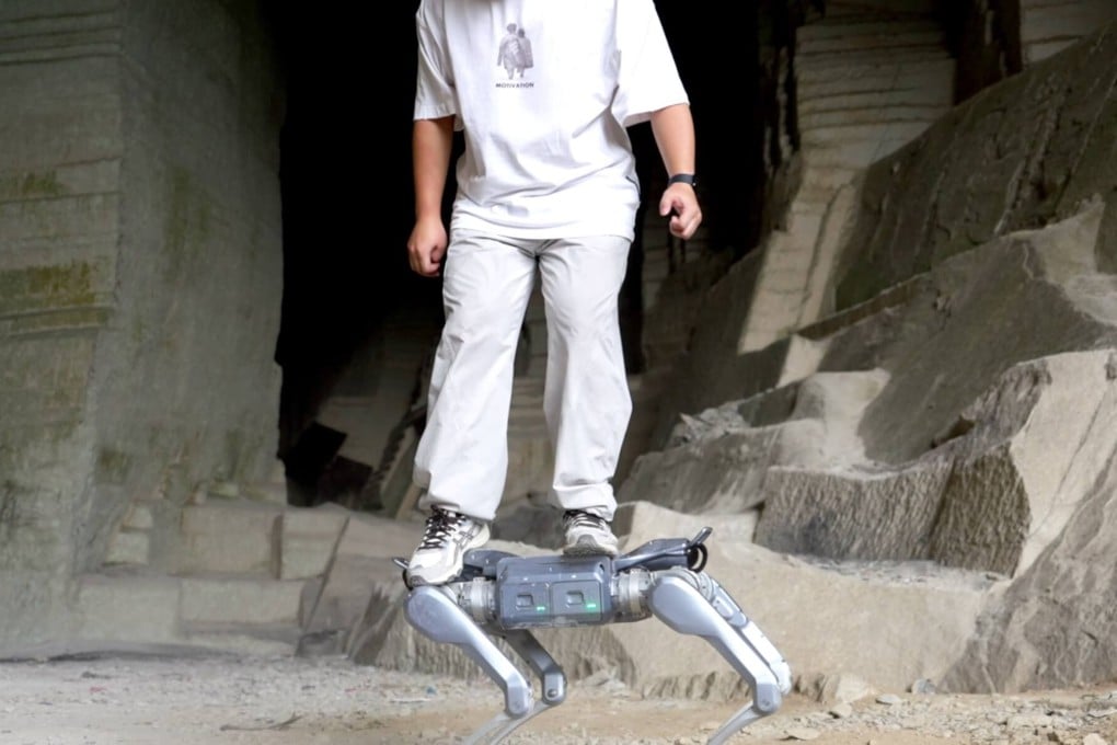 A man stands on Unitree Robotics’ new robot dog, the A2. Photo: Handout