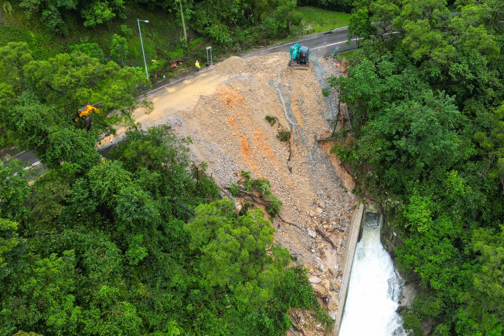 A section of Bride’s Pool Road in Tai Po was damaged during a landslide on Tuesday amid torrential rain. Photo: Sam Tsang