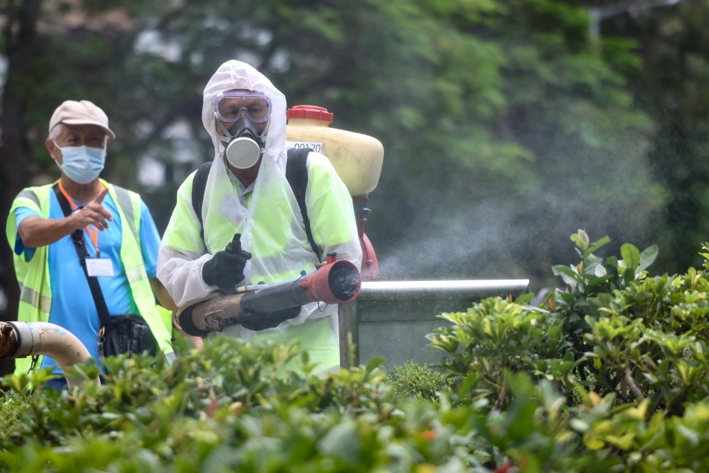 Workers conduct mosquito control measures at Lei Tung Estate. Photo: Karma Lo