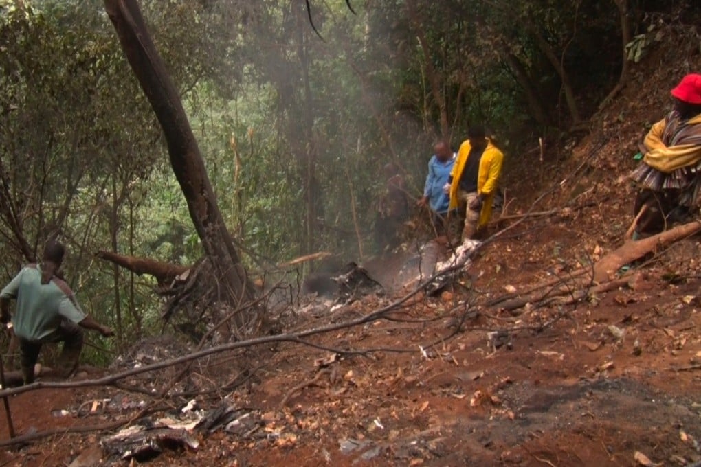 People work at the site of a military helicopter crash in Sikaman near Adansi, in Ghana’s Ashanti region on Wednesday. Photo: AP