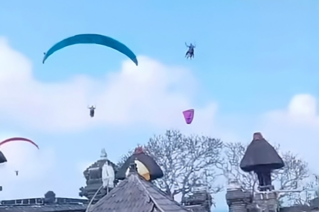 Footage showing paragliders flying near Pura Gunung Payung Temple in Bali on Sunday. Photo: Instagram/niluhdjelantik
