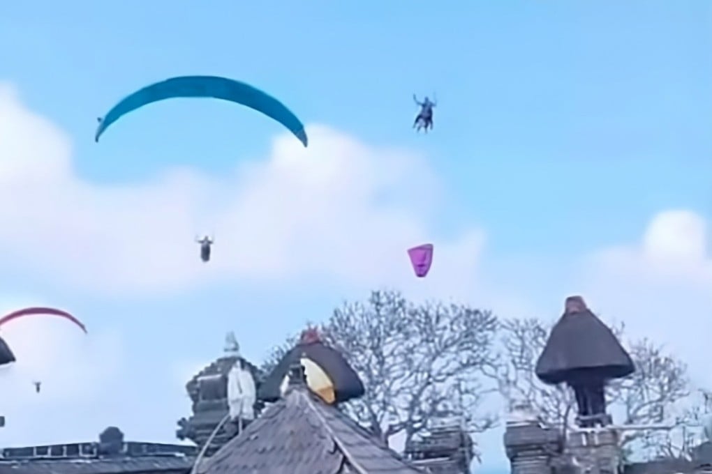 Footage showing paragliders flying near Pura Gunung Payung Temple in Bali on Sunday. Photo: Instagram/niluhdjelantik