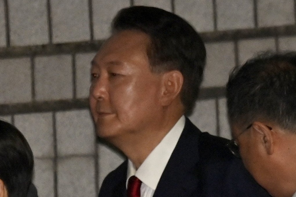 Former South Korean president Yoon Suk-yeol exits Seoul Central District Court after attending a hearing last month to review the legality of his detention. Photo: Yonhap/EPA