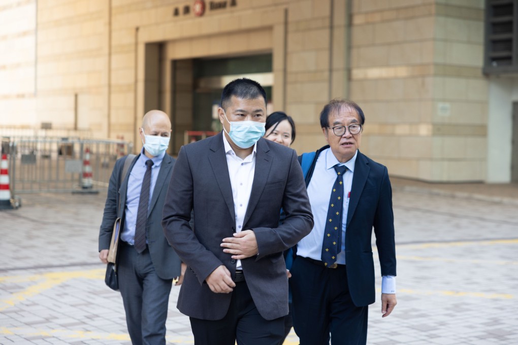 Football coach Wong Chi-wai (front) leaves West Kowloon Court with his lawyers after he is acquitted of indecent assault for a second time. Photo: Brian Wong