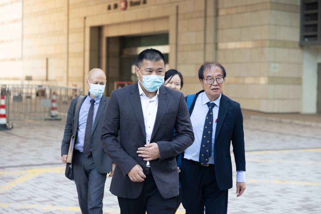 Football coach Wong Chi-wai (front) leaves West Kowloon Court with his lawyers after he is acquitted of indecent assault for a second time. Photo: Brian Wong