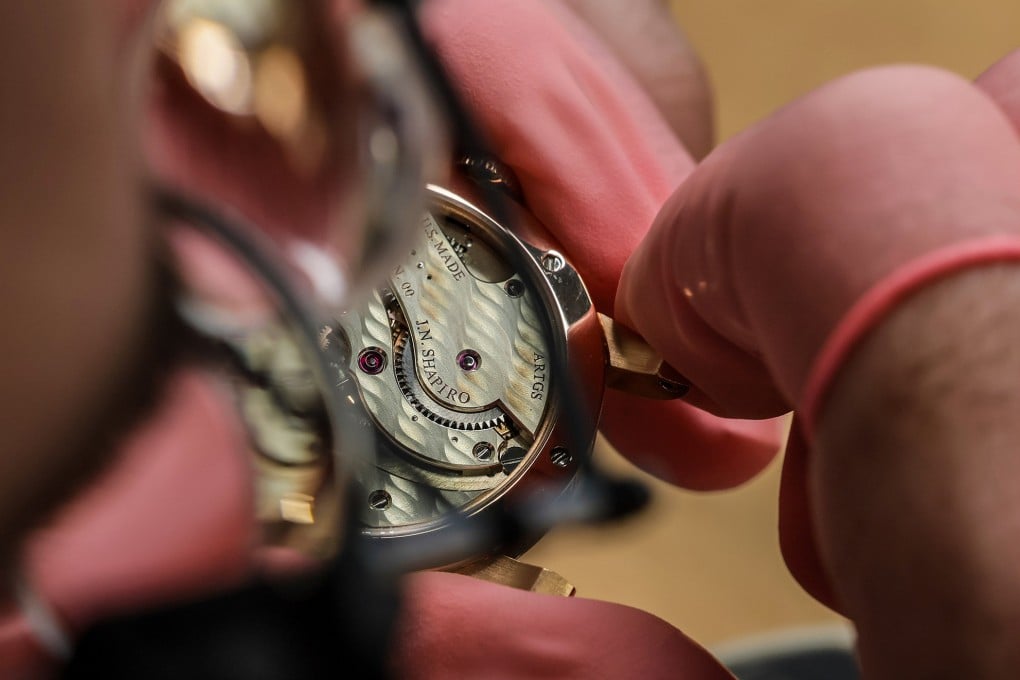 Spencer Torok, a watchmaker at JN Shapiro Watches, inspects the inner workings of an Insurgence series watch in Torrance, California on July 24, 2025. Torok trained at the Rolex watchmaking school in Lititz, Pennsylvania. Photo: TNS