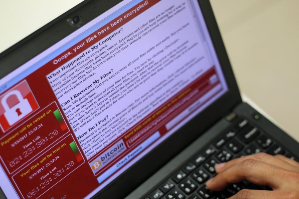 A programmer shows a sample of a ransomware cyberattack on a laptop in Taipei, Taiwan, May 13, 2017. Photo: EPA