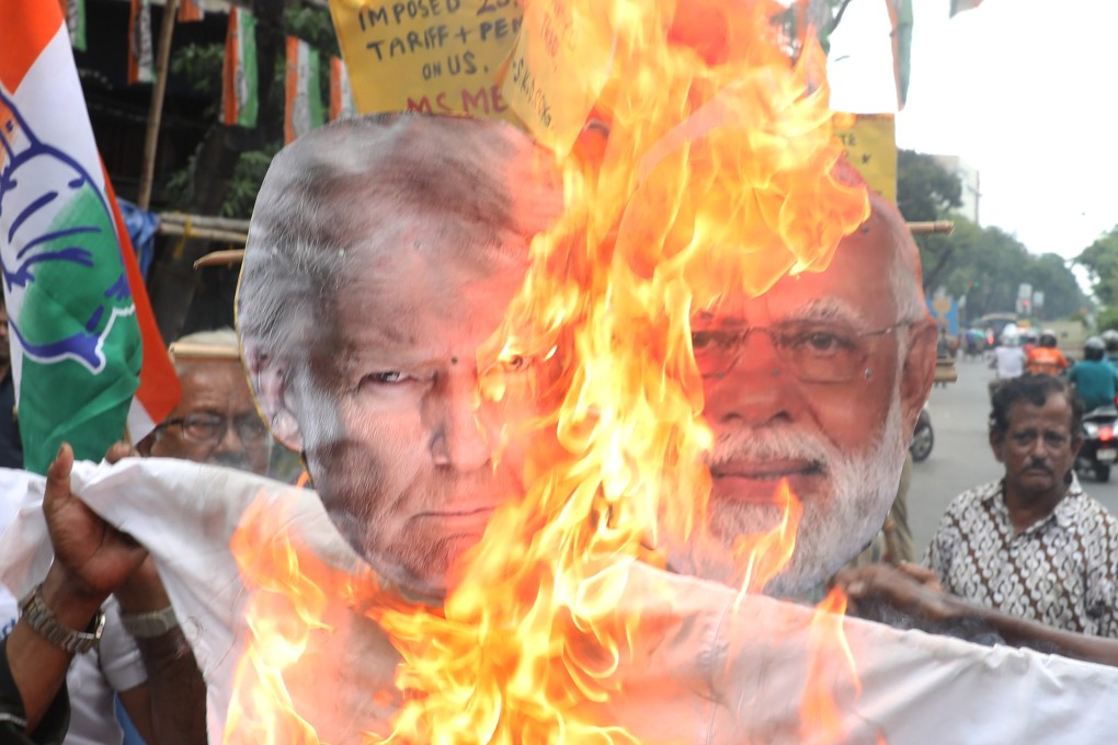 Supporters of India’s main opposition Congress party burn an effigy of US President Donald Trump and Indian Prime Minister Narendra Modi during a protest against the Trump administration’s 25 per cent tariff on all Indian goods. Photo: Zuma Press Wire/dpa